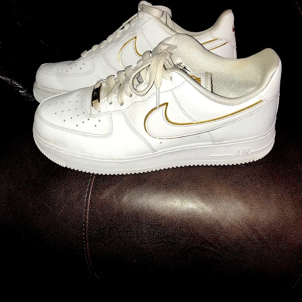Nike Air Force 1 shoes with gold